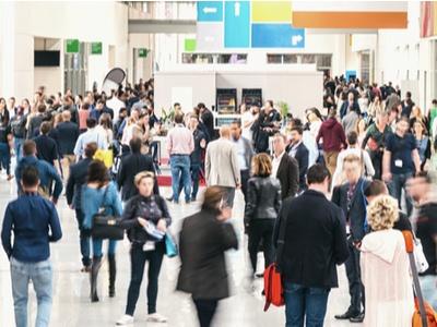 Large crowd of people at an exhibition hall