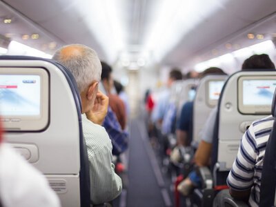 People in airline cabin